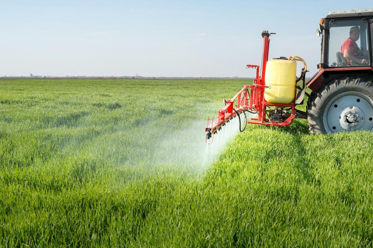 tractor spreading fertilizer