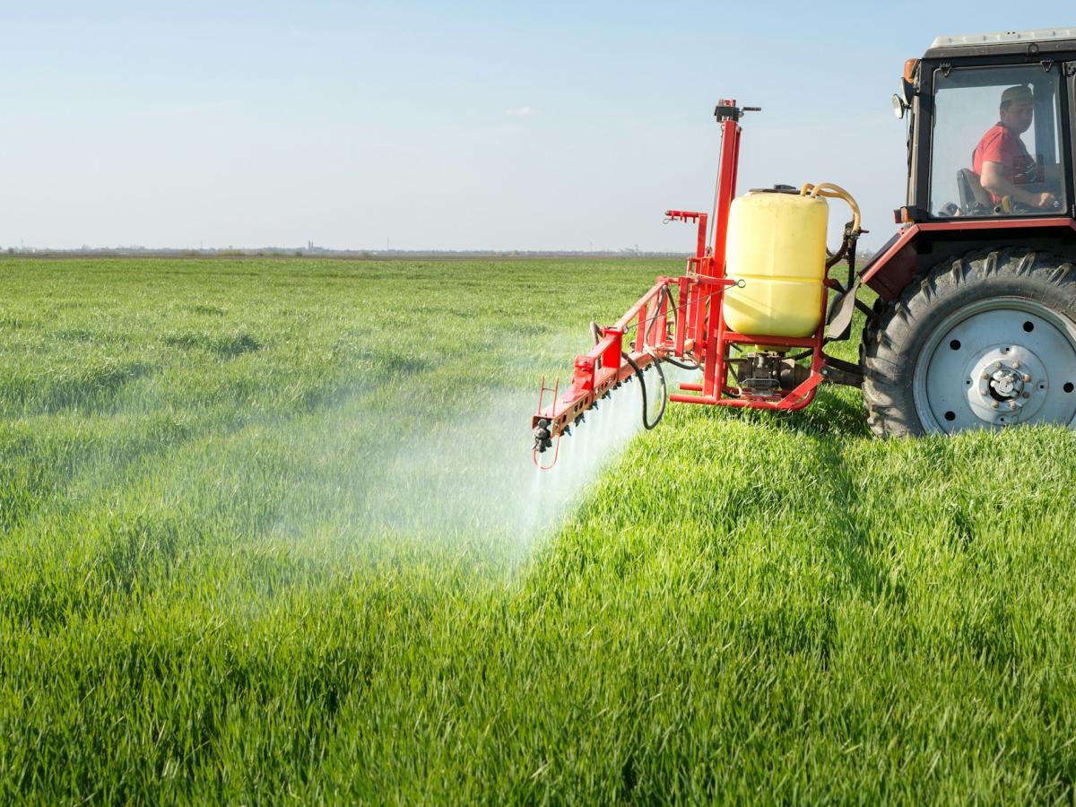 tractor spreading fertilizer